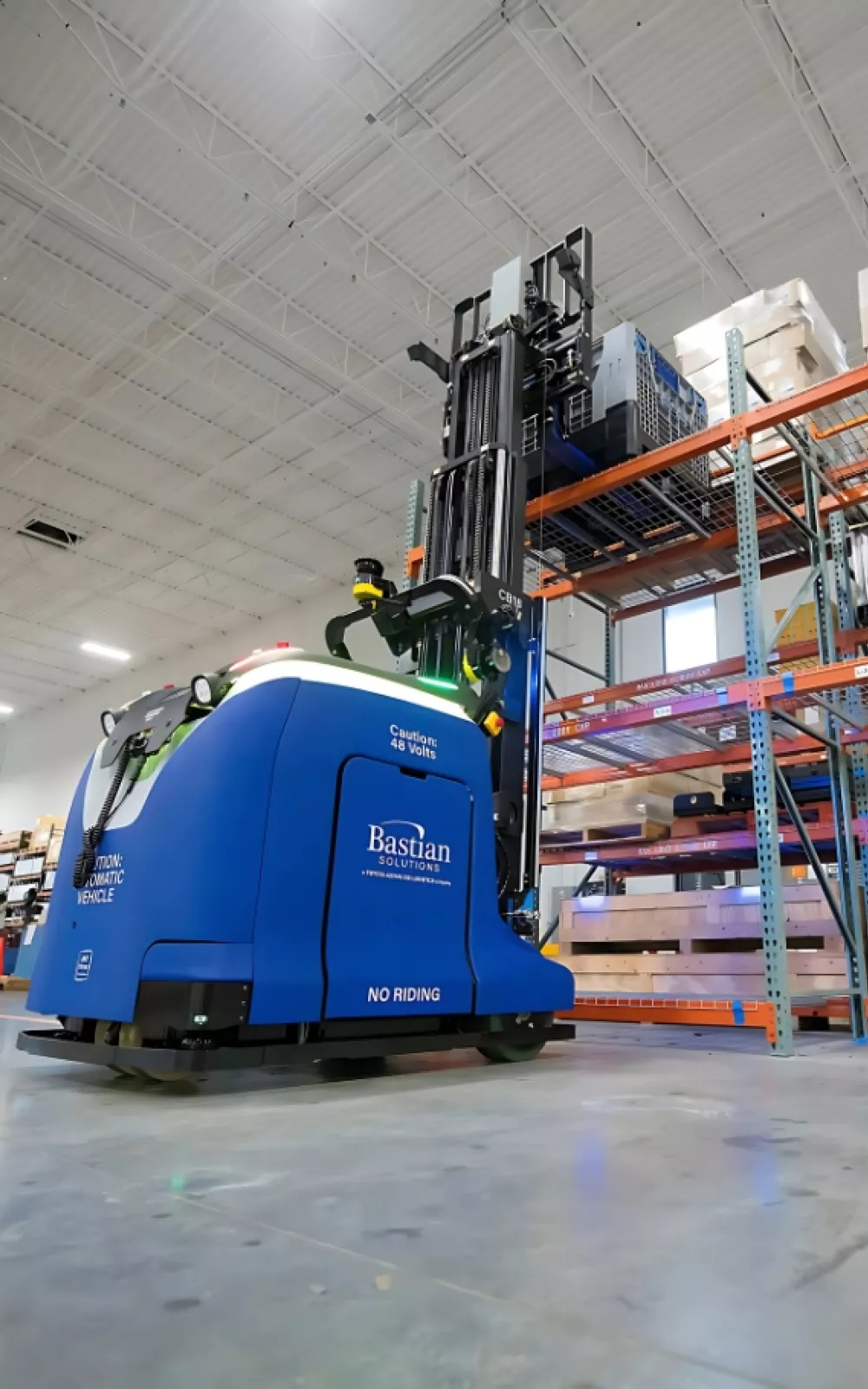 Toyota Bastian Solutions CB18 automated guided vehicle placing product on pallet racking.