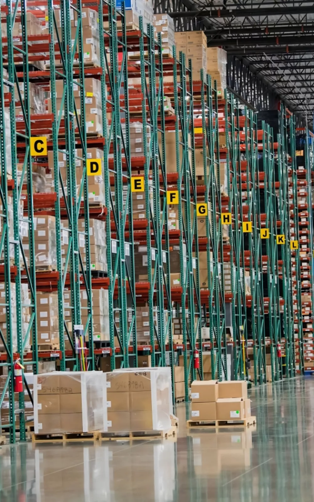 Multiple rows of pallet racking in a warehouse.