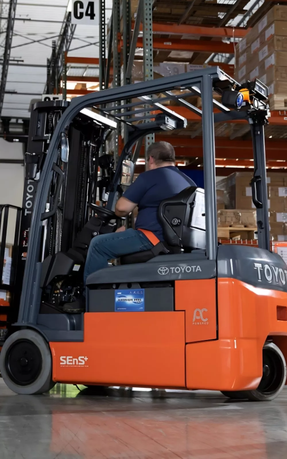 Toyota 3-wheel electric forklift moving product in cold storage industry.