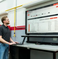 Manager reviewing MyInsights Telematics fleet management reports.