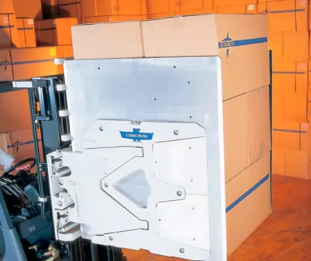 Toyota forklift with a Cascade carton clamp carrying product.