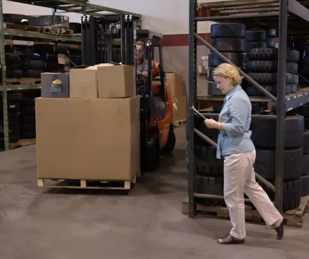 Forklift safety and forklift pedestrian walking in front of forklift. 