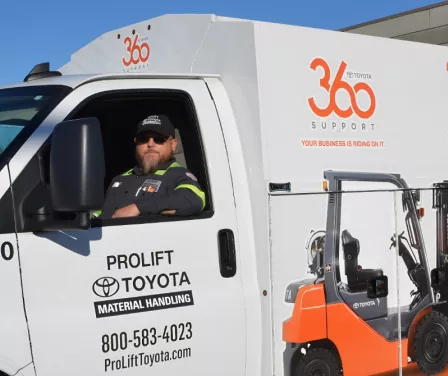 ProLift Toyota service technician sitting in service vehicle. 