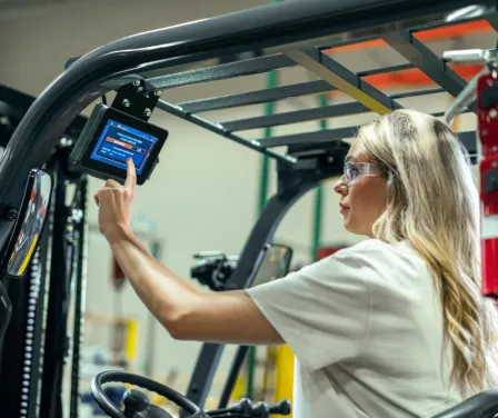 Forklift operator performing daily checklist on MyInsights Telematics.