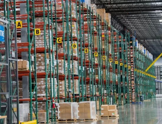 Multiple rows of pallet racking in a warehouse.