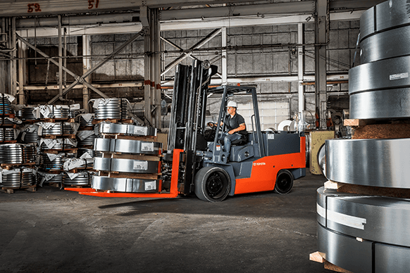 high capacity electric forklift moving steel rolls