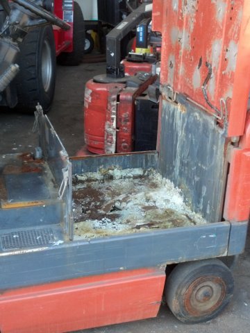 Damaged forklift battery compartment