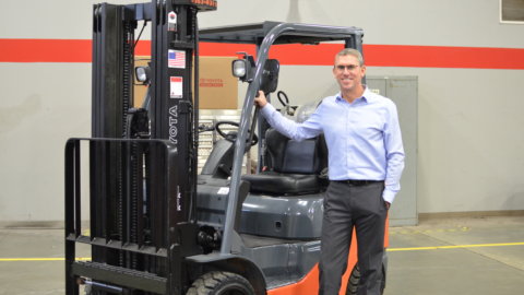 Chris Frazee, ProLift President standing near a Toyota Forklift