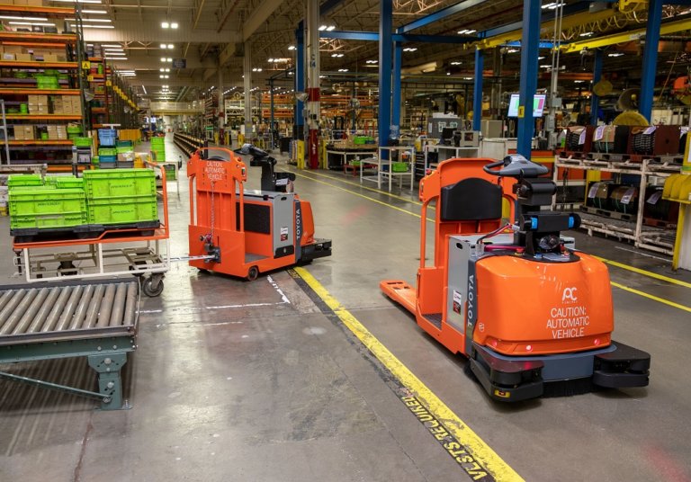 Center-Controlled Rider Automated Forklift at work in the warehouse